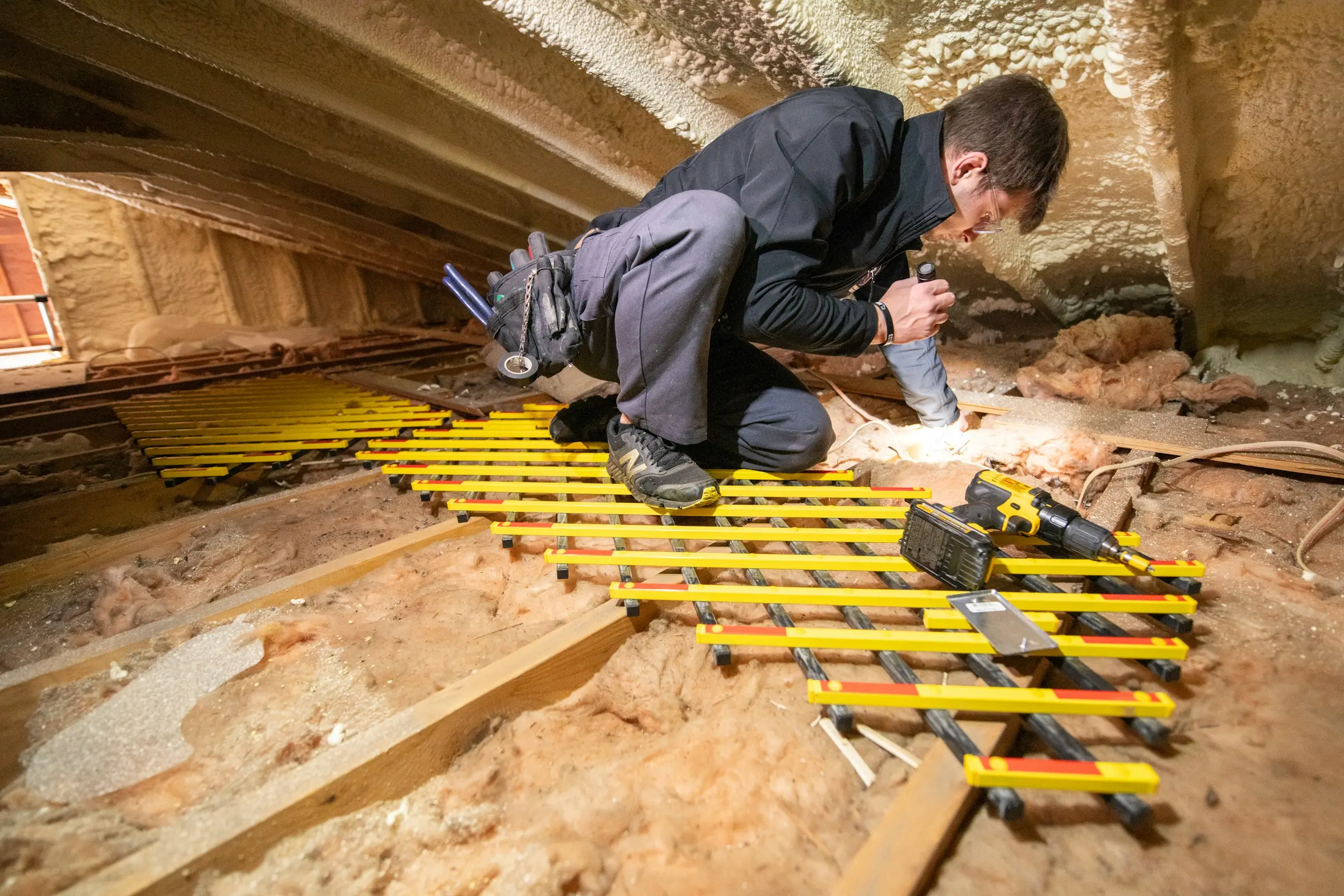 Attic insulation being installed in an Irish home
